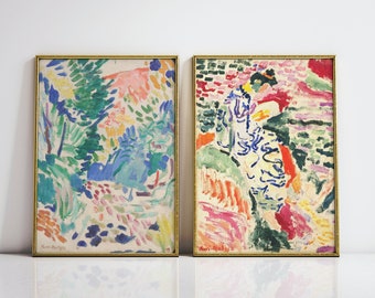 May include: Two framed abstract paintings with colorful brushstrokes. The painting on the left features a landscape with green, blue, and pink hues. The painting on the right features a figure in a white dress with blue and red accents.
