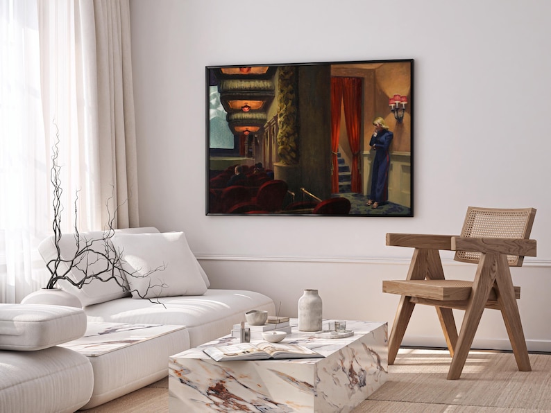 May include: A framed painting depicting a woman in a blue dress standing in a theater lobby. The woman is looking down and appears to be lost in thought. The painting is set against a backdrop of red velvet seats and ornate architectural details.