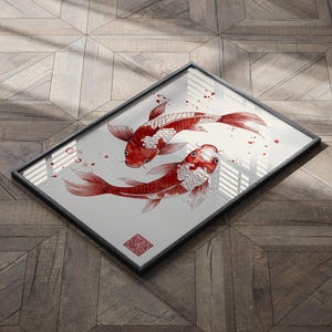 May include: A framed print of two red and white koi fish swimming in a circle. The fish are drawn in a minimalist style with black ink on a white background.
