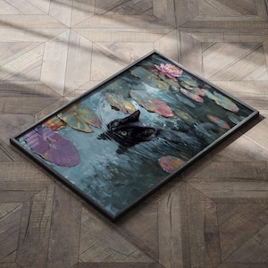 May include: Framed artwork depicting a black cat swimming in a pond with lily pads and a pink water lily. The painting has a dark, moody color palette with shades of green, blue, and purple. The frame is a dark gray color.