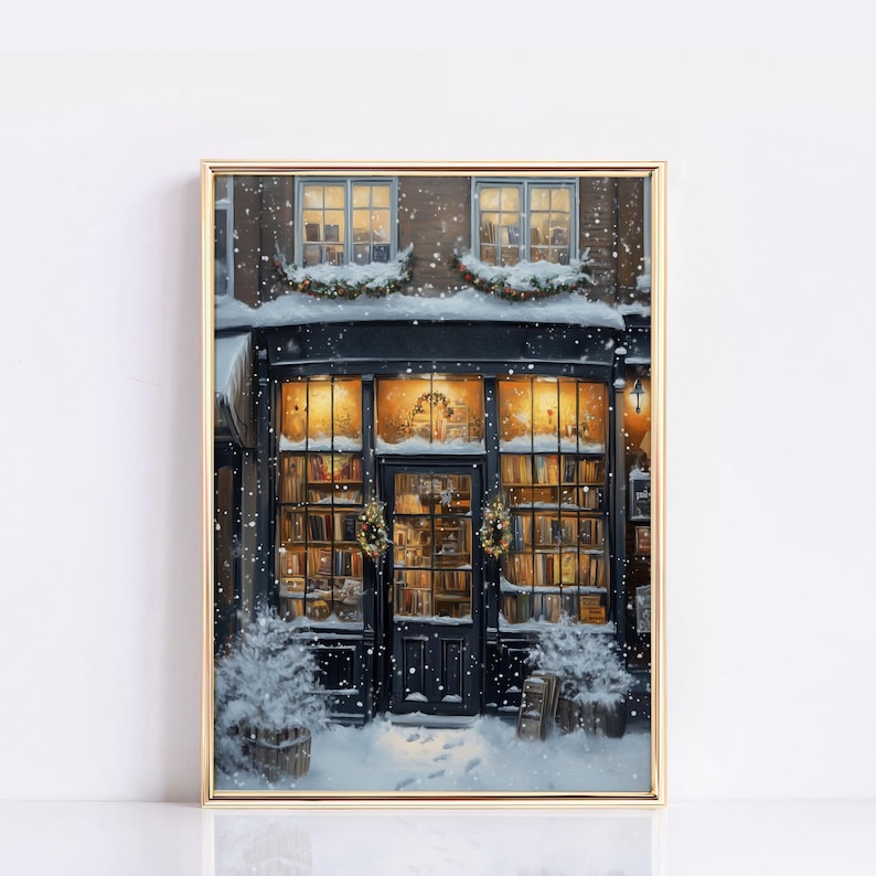 May include: A storefront with a black door and windows filled with books. The windows are decorated with wreaths and the storefront is covered in snow. The building is lit up with warm yellow lights.