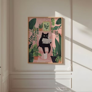 May include: A black cat sitting on a toilet reading a newspaper in a bathroom with pink walls and green plants.