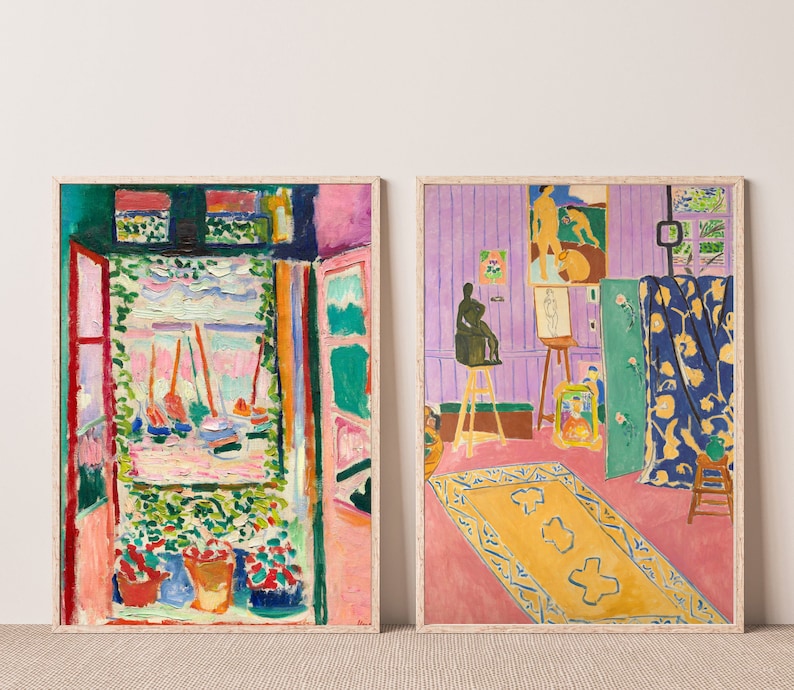 May include: Two framed paintings of abstract art. The painting on the left is a colorful scene with a window looking out onto a harbor with sailboats. The painting on the right is a room with a purple wall, a rug, and a sculpture.