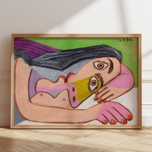 May include: A colorful painting of a woman lying down with her head resting on her arm. Her eyes are large and expressive, and her hair is long and dark. The background is a green and white abstract design.
