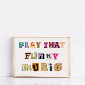Puede incluir: Una impresi&oacute;n enmarcada en dorado con el texto "PLAY THAT FUNKY MUSIC" en letras de colores recortadas.