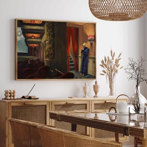 May include: A painting of a woman standing in a theater lobby, looking down at the floor. The woman is wearing a blue dress and has blonde hair. The theater lobby is dimly lit and has red velvet seats.