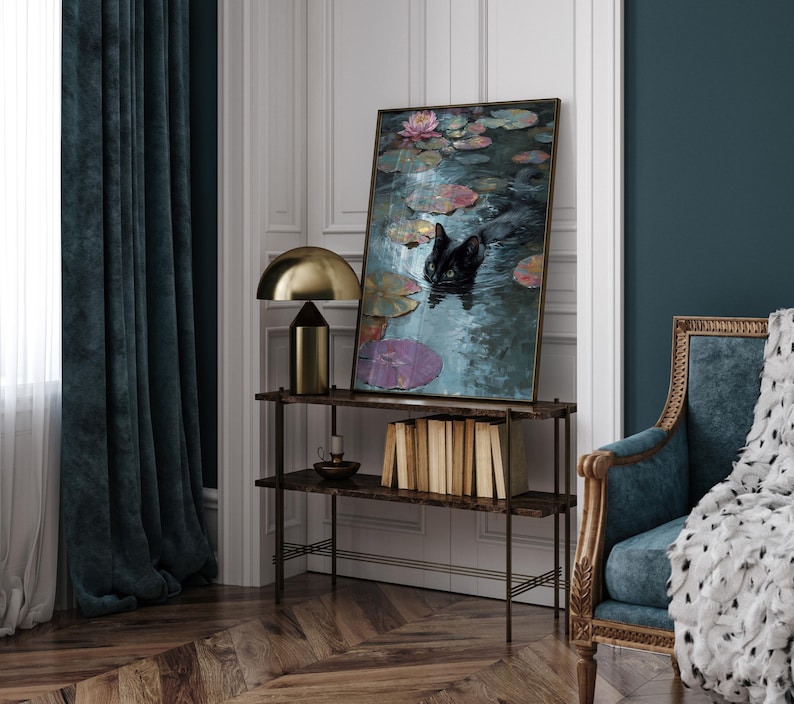 May include: An interior scene featuring a framed painting of a black cat in a pond with lily pads and flowers. A gold lamp and a shelf with books and a candle holder are also visible. The room has dark teal curtains and a patterned wooden floor.