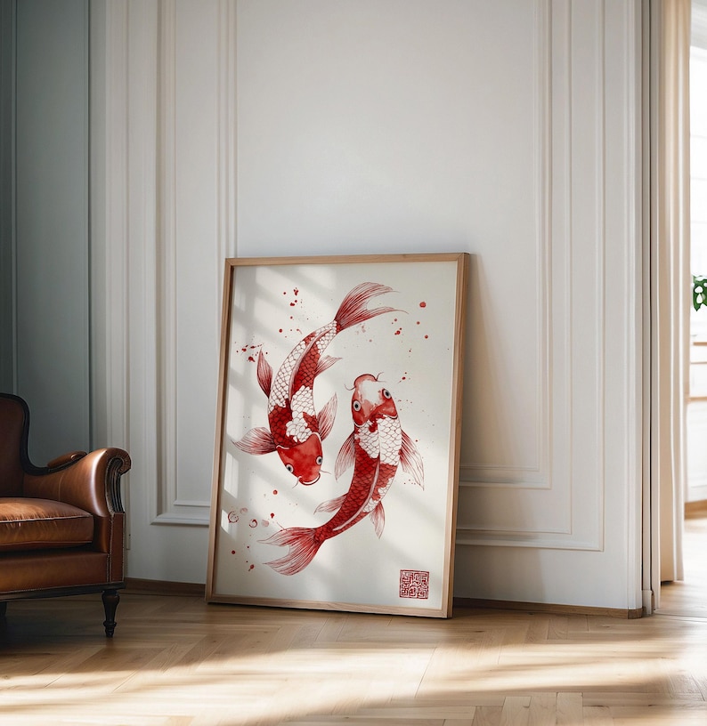May include: A framed print of two red and white koi fish swimming in a circle against a white background with red ink splatters. The print is in a wooden frame.