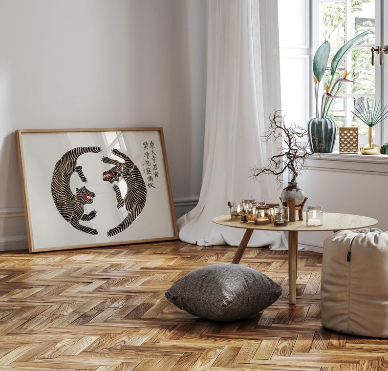 May include: A framed print of two black and white tigers in a circle, with the Chinese characters "身入虎穴, 心存正氣" written in black on a white background.