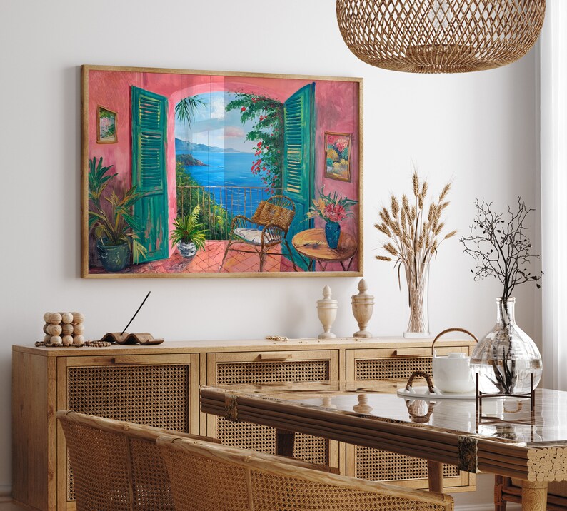 May include: A painting of a seascape with a view from an open window. The window is framed in green and the scene is painted in shades of blue, green, and pink. The painting is framed in a wooden frame.
