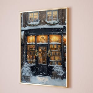 May include: A painting of a bookstore with a black storefront and windows filled with books. The store is decorated for Christmas with wreaths and garlands. It is snowing outside.