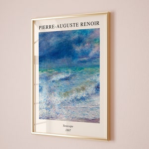 May include: A framed print of a seascape painting by Pierre-Auguste Renoir. The painting depicts a stormy sea with large waves crashing against the shore. The sky is a mix of blue, purple, and pink hues. The painting is titled "Seascape" and dated 1897.