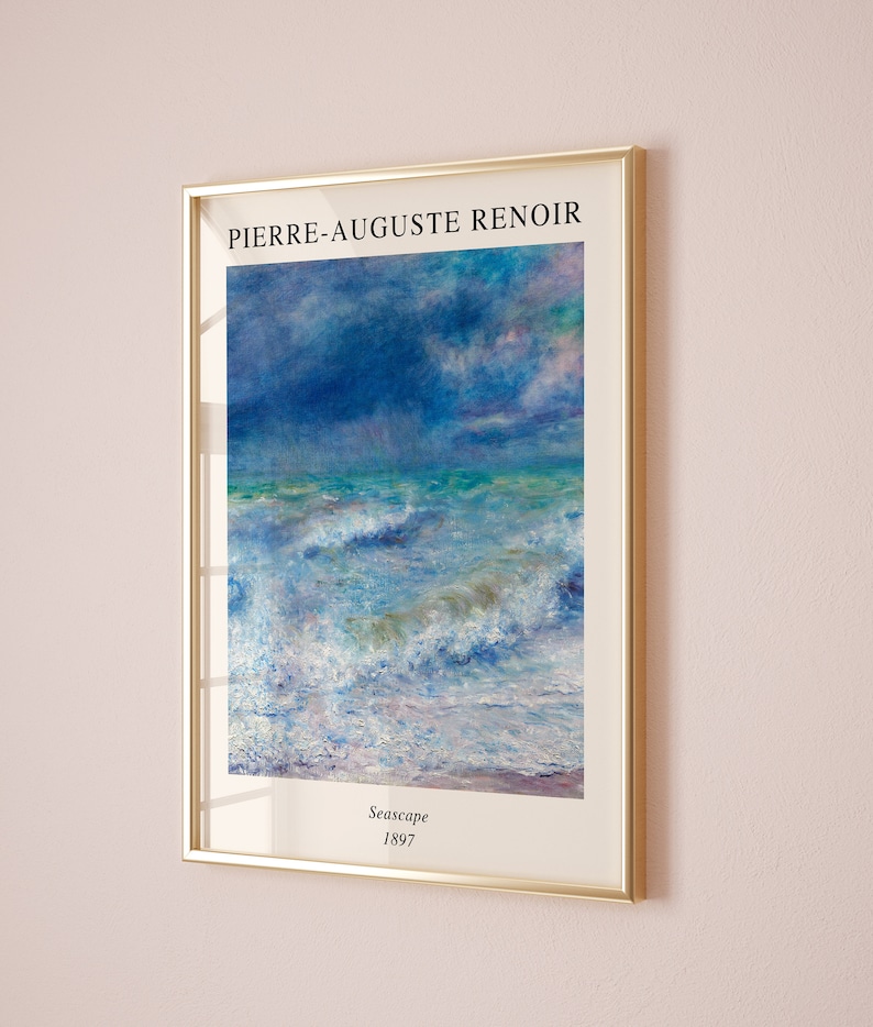 May include: A framed print of a seascape painting by Pierre-Auguste Renoir. The painting depicts a stormy sea with large waves crashing against the shore. The sky is a mix of blue, purple, and pink hues. The painting is titled "Seascape" and dated 1897.