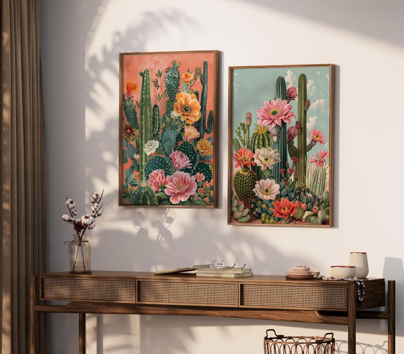May include: Two framed prints of colorful cactus and flower illustrations. The prints are in a vintage style and feature a variety of cacti and flowers in shades of pink, red, yellow, and green.