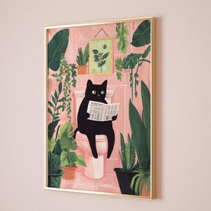 May include: A black cat sits on a pink toilet reading a newspaper in a bathroom with pink tile and many green plants.