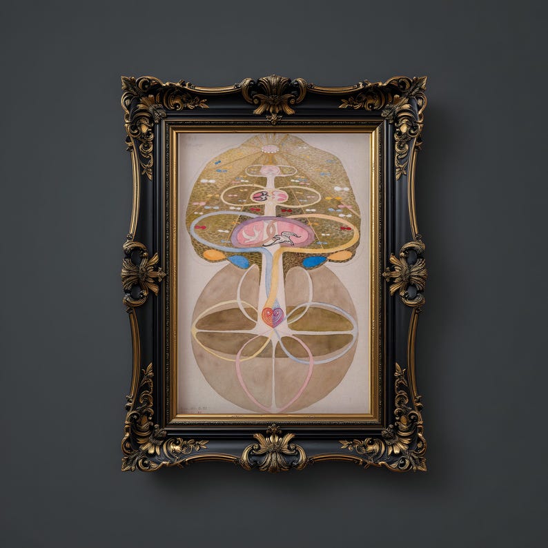 May include: A framed print of a colorful, abstract illustration depicting a tree with a heart at its center. The tree is surrounded by concentric circles and other geometric shapes. The artwork is framed in a black and gold ornate frame.