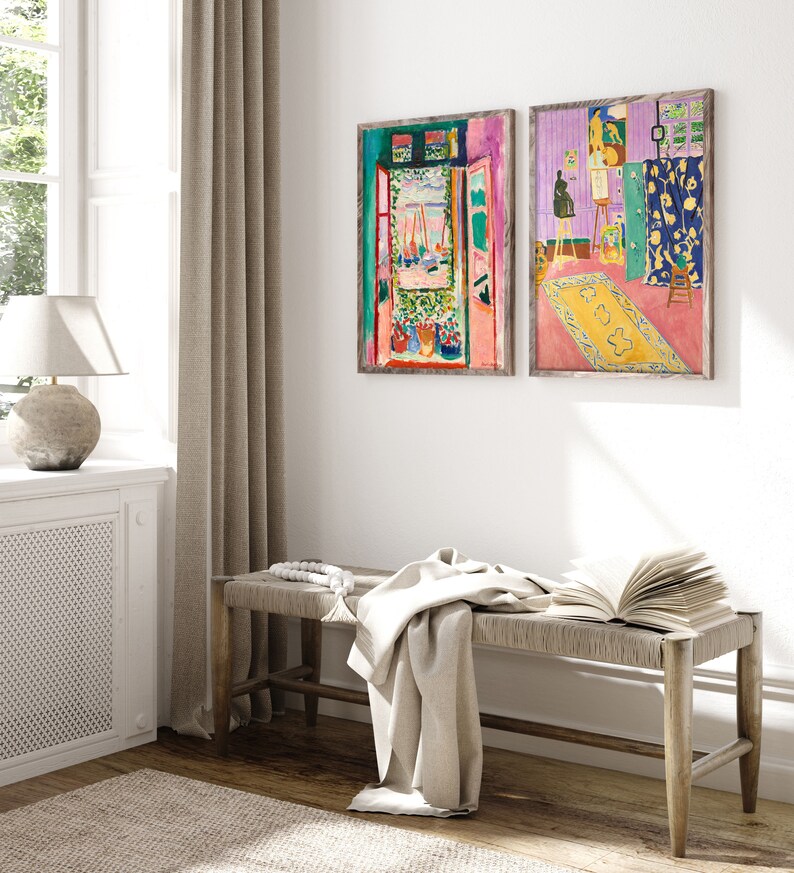 May include: Two framed paintings of a room with an open window and a view of a harbor. The paintings are in a modern style with bright colors and bold brushstrokes.