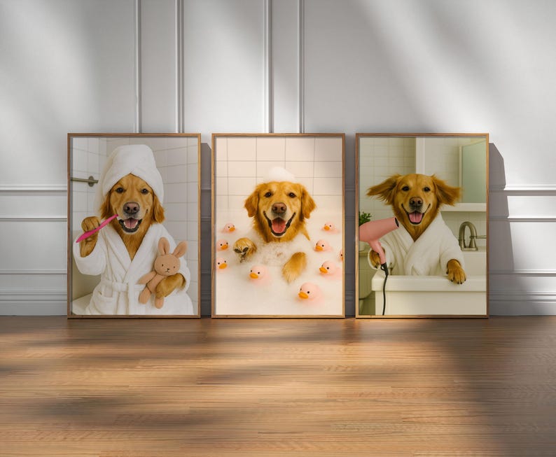 May include: Three framed prints featuring a golden retriever in a bathroom setting. One dog is brushing its teeth, another is in a bubble bath with rubber ducks, and the third is using a hairdryer. Each dog wears a white robe.