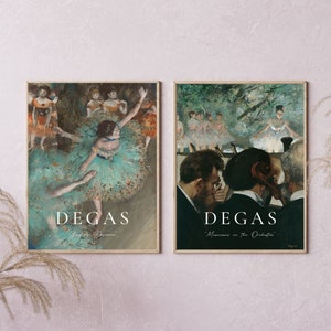 May include: Two framed prints of paintings by Edgar Degas. The first print shows a ballerina in a green and white tutu, dancing on stage. The second print shows musicians in an orchestra, with a focus on the conductor. Both prints have the artist's name and the title of the painting.
