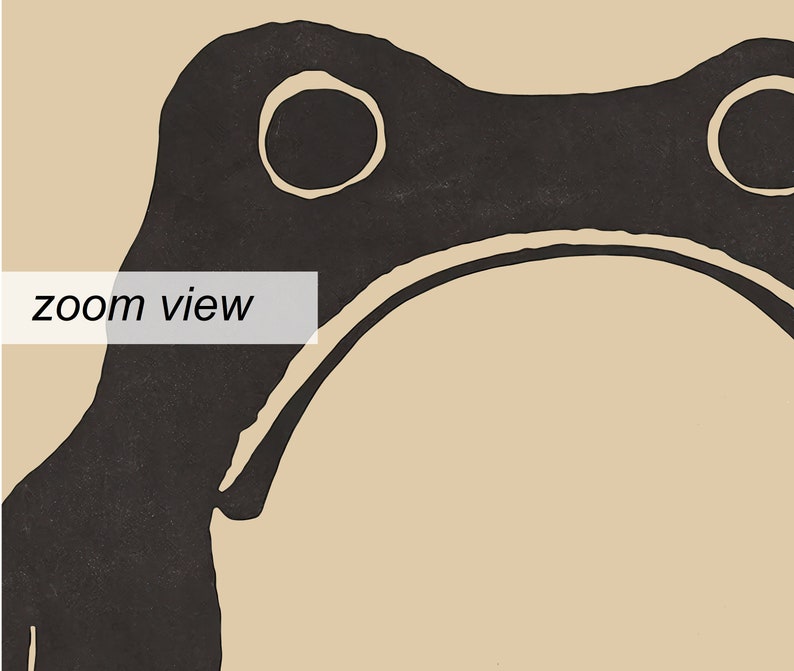 May include: Black and white illustration of a frog with a simple, minimalist design. The frog is facing forward with its mouth closed and its eyes are large and round. The frog is outlined in black and filled in with white. The background is a light beige color.