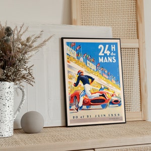 May include: A vintage poster for the 24 Hours of Le Mans race, featuring a blue sky, a red race car, and a driver running towards the finish line. The poster text reads "24H du MANS 20 et 21 JUIN 1959".