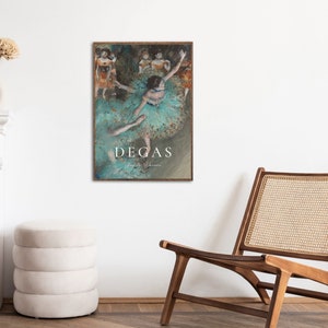 May include: A framed art print featuring a painting of a ballerina in a green tutu, with other dancers in the background. The print is titled "Degas" and includes the artist's signature.