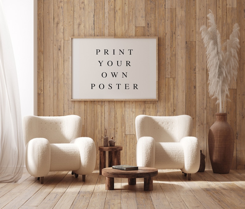 May include: A living room interior with two white fluffy armchairs, a wooden coffee table, and a framed poster on the wall that reads "PRINT YOUR OWN POSTER".