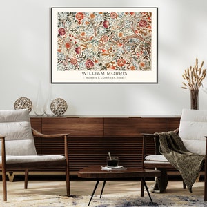 May include: A framed print of a floral pattern with a white background and red, blue, and green flowers. The print is titled "William Morris - Morris & Company, 1866."