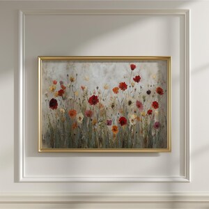 May include: A framed floral painting depicting a field of flowers in red, orange, and yellow hues. The artwork is set against a muted backdrop and enclosed in a gold-coloured frame, creating a decorative wall art piece for the home.