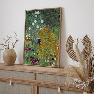 May include: A framed painting of a garden with a variety of flowers in shades of orange, white, purple, and green. The flowers are arranged in a loose, natural pattern, and the background is a soft green.
