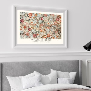 May include: A framed print of a floral pattern with red, orange, and green flowers and leaves. The print is titled "William Morris - Morris & Company, 1862 -"