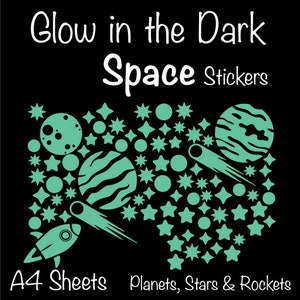May include: A4 sheet of glow-in-the-dark space stickers. The stickers feature planets, stars, and rockets in a teal color against a black background. The text "Glow in the Dark Space Stickers" is at the top of the image, and the text "A4 Sheets Planets, Stars & Rockets" is at the bottom.