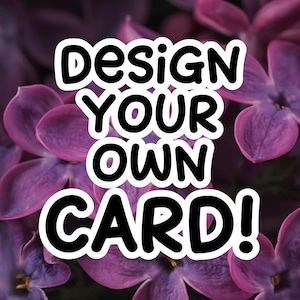 May include: The image features the text "Design Your Own Card!" in a bold, black font with a white outline, set against a backdrop of blurred purple flowers. The overall aesthetic is vibrant and eye-catching, suitable for stationery or card design.