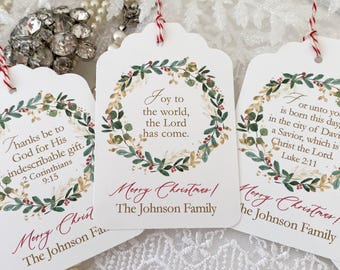 May include: Three Christmas gift tags with a green and gold wreath design. The tags feature different Christmas-themed quotes and the text "Merry Christmas! The Johnson Family".