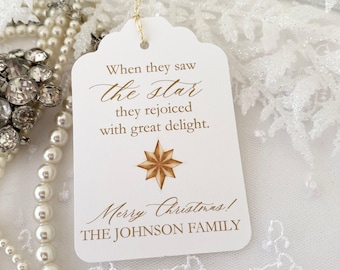 May include: White gift tag with a gold star and the text "When they saw the star they rejoiced with great delight. Merry Christmas! THE JOHNSON FAMILY"