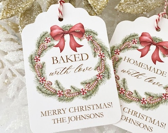 May include: White gift tags with a green and red candy cane wreath, a red bow, and gold text that reads "Baked with love" and "Merry Christmas! The Johnsons".