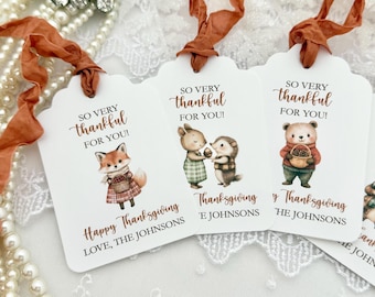 May include: White rectangular gift tags with rounded corners and rust-colored ribbon ties. Each tag features illustrations of woodland animals, the text SO VERY thankful FOR YOU!, Happy Thanksgiving, and the personalized text LOVE, THE JOHNSONS.