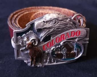 Hebilla de cinturón vintage de 1988 de Colorado Siskiyou con águila, carnero de cuernos grandes y esmalte de peltre L35