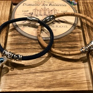 Natural Cork  5 mm with a Hamsa Hand and Evil Eye Amulet bracelet. Great Gift! Send to friend!