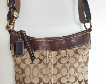 Brown Coach shoulder bag with leather accents and adjustable straps bag