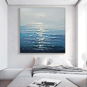 May include: A painting of a seascape with blue and white waves, a light blue sky, and two small red sailboats in the distance.