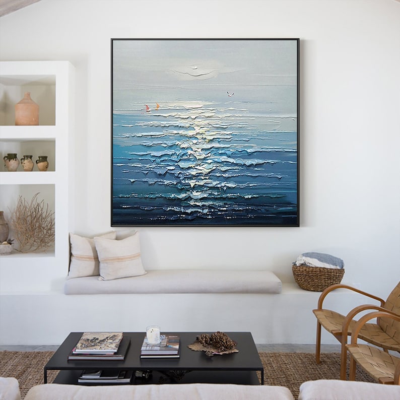 May include: A painting of a seascape with blue and white waves, a light blue sky, and two small red sailboats in the distance.