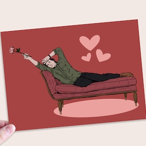 May include: A cartoon illustration of a person lying on a red couch with a single pink rose in hand. The background is red with three pink hearts.