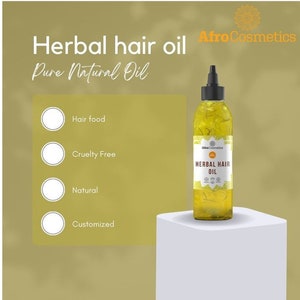 May include: A clear glass bottle of herbal hair oil with a yellow label that reads "Herbal Hair Oil" and "Afro Cosmetics". The bottle is sitting on a white platform. The text "Hair food", "Cruelty Free", "Natural", and "Customized" is visible on the left side of the image.