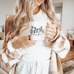 May include: White ceramic mug with black floral design and the text "grow in grace 2 Peter 3:18".