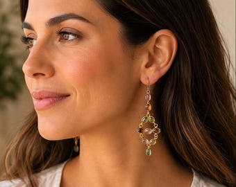 May include: A gold drop earring featuring a series of small, oval-shaped multicolored gemstones arranged in a geometric, openwork lattice pattern. The earring hangs from a simple gold hook and includes shades of pink, green, and brown stones.