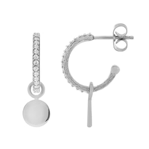 May include: A pair of silver hoop earrings with a small, round charm dangling from one earring. The hoop is decorated with small, clear stones.