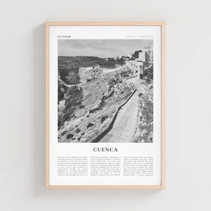 May include: Black and white framed print of Cuenca, Ecuador. The image shows a winding road leading through a mountainous landscape. The word "Ecuador" is at the top, and "Cuenca" is centered below the image. Text is at the bottom.