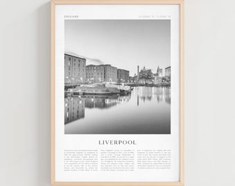 May include: Black and white framed print of Liverpool, England, featuring a waterfront view with buildings and boats. The print includes the city's name and geographical coordinates. The frame is a light wood color.