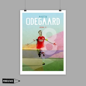 May include: A poster featuring Martin Odegaard of Arsenal FC. The player is in a red and white jersey with the Emirates Fly Better logo. The number 8 is prominently displayed. The background has a gradient of colors.